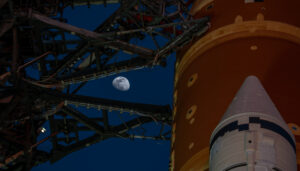 Moon Seen Shining on Full Artemis II Stack at Launch Pad 39B