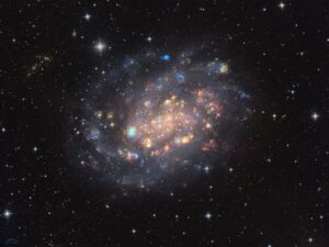 NGC 300: A Cosmic Gemstone with Stars and Gas Clouds